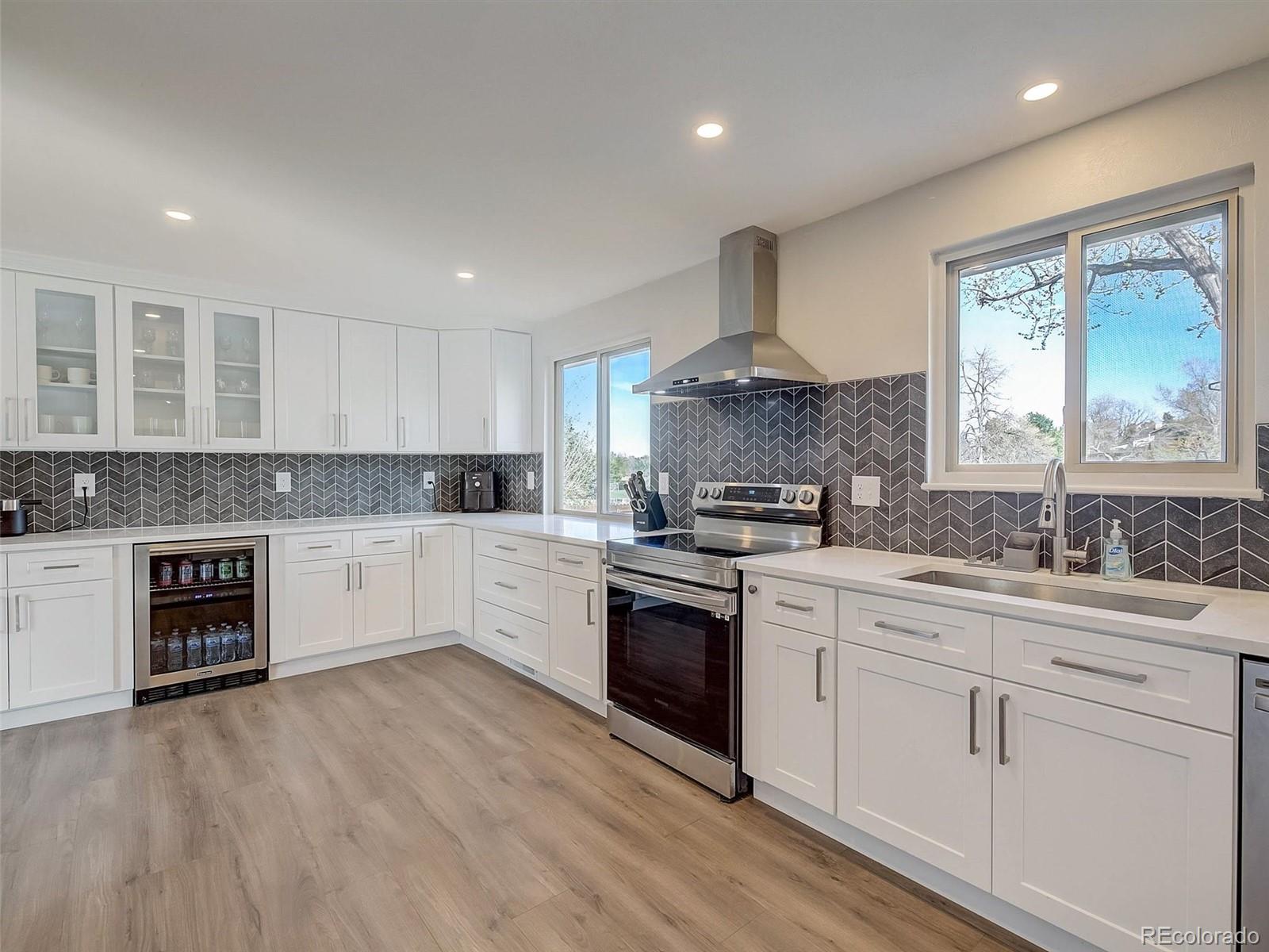 6432 South Birch Circle Centennial, CO 80121 - Photo 4 of 40 a kitchen with a white cabinets and window