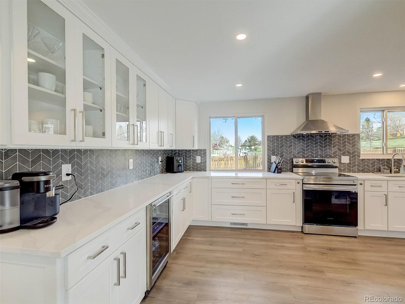 6432 South Birch Circle Centennial, CO 80121 - Photo 7 of 40 a kitchen with stainless steel appliances granite countertop a stove and a sink
