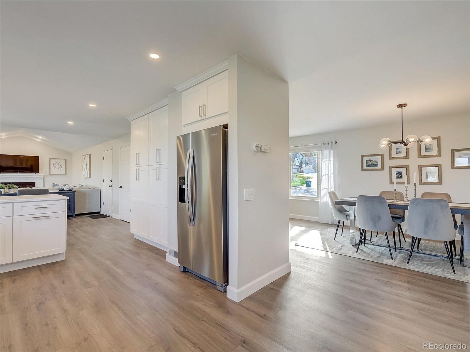 6432 South Birch Circle Centennial, CO 80121 - Photo 9 of 40 a view of kitchen with cabinets and wooden floor