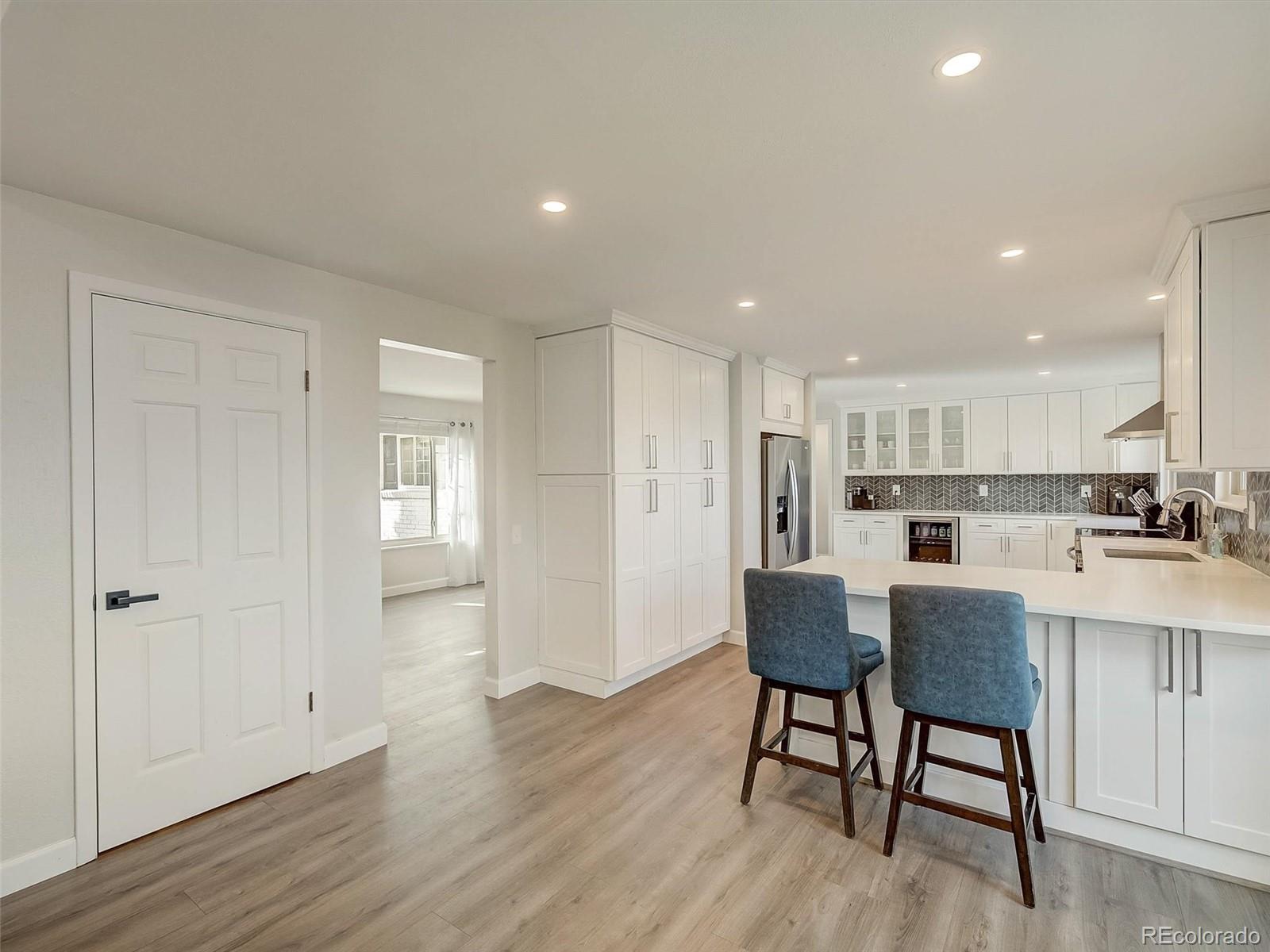 6432 South Birch Circle Centennial, CO 80121 - Photo 10 of 40 a view of kitchen with refrigerator and wooden floor