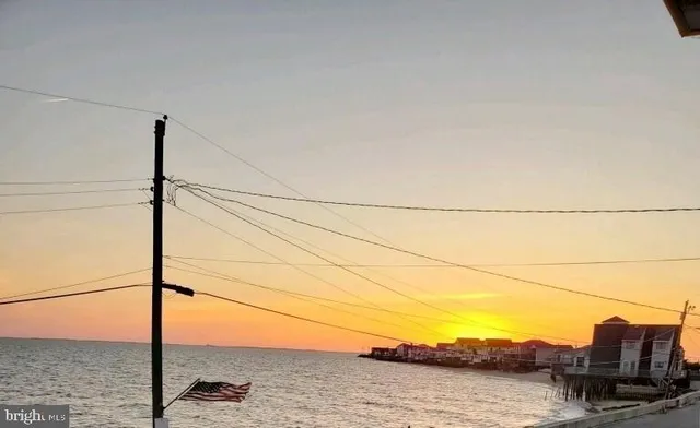 a view of a street with a car parked side of it