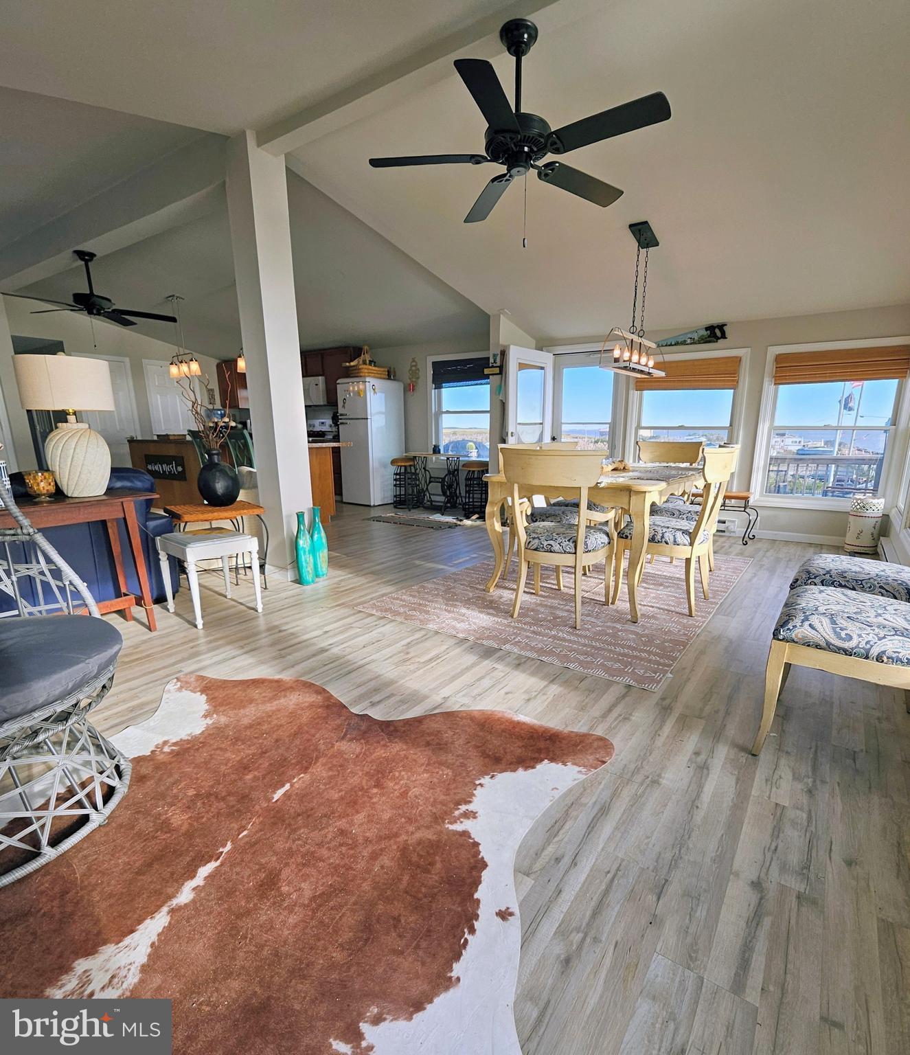 167 Cove Road Newport, NJ 08345 - Photo 15 of 37 a living room with lots of furniture and kitchen view
