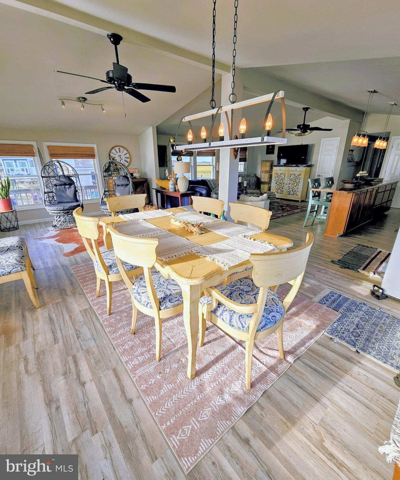 167 Cove Road Newport, NJ 08345 - Photo 17 of 37 a view of a dining room with furniture wooden floor and chandelier