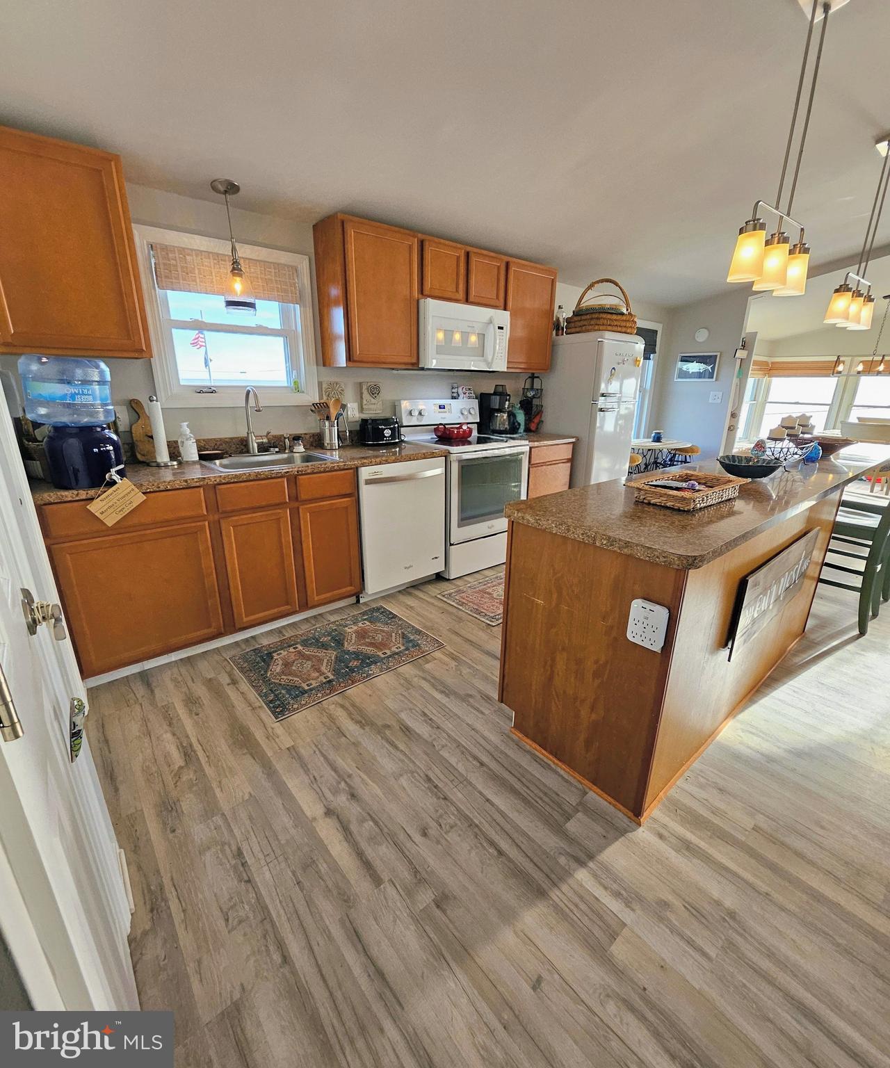 167 Cove Road Newport, NJ 08345 - Photo 20 of 37 a kitchen with stainless steel appliances granite countertop a stove and a sink