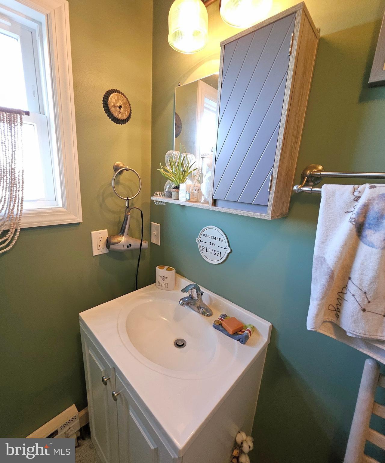 167 Cove Road Newport, NJ 08345 - Photo 28 of 37 a bathroom with a sink and a mirror