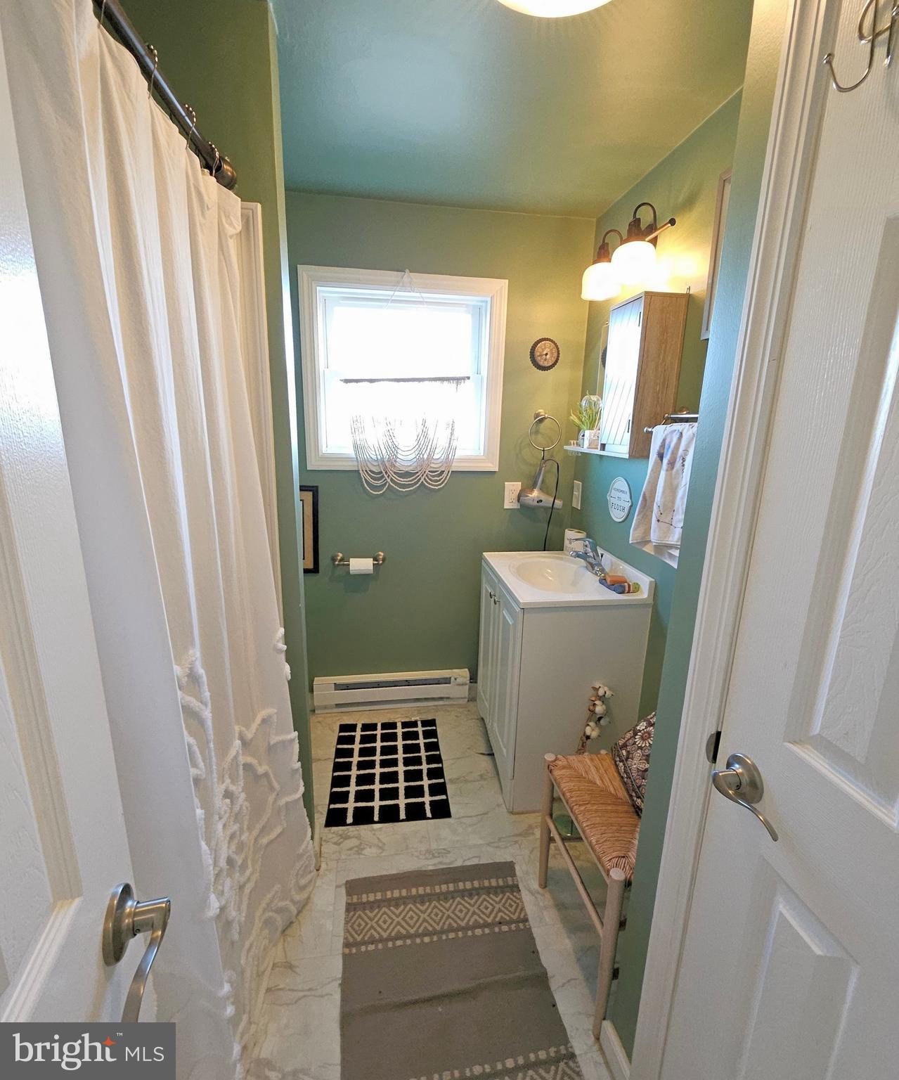 167 Cove Road Newport, NJ 08345 - Photo 29 of 37 a bathroom with sink toilet and shower