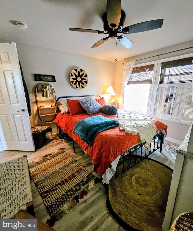 167 Cove Road Newport, NJ 08345 - Photo 30 of 37 a bedroom with two beds and a chandelier