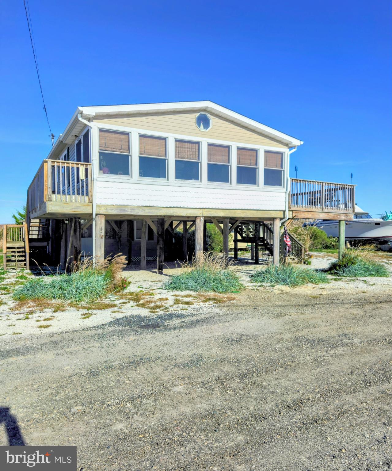 167 Cove Road Newport, NJ 08345 - Photo 3 of 37 a front view of a house with a yard