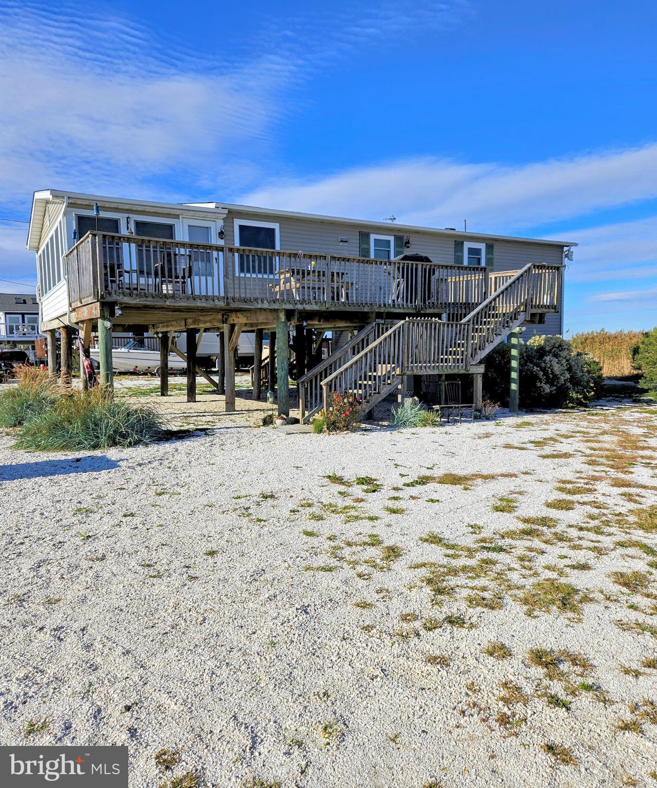 167 Cove Road Newport, NJ 08345 - Photo 4 of 37 a view of a terrace with a bench