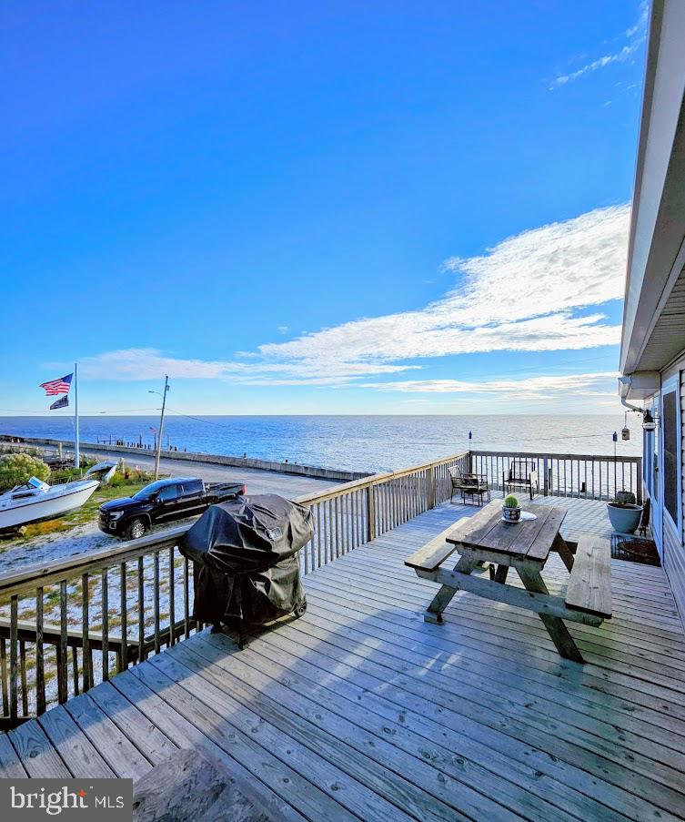 167 Cove Road Newport, NJ 08345 - Photo 7 of 38 a view of a balcony with chairs