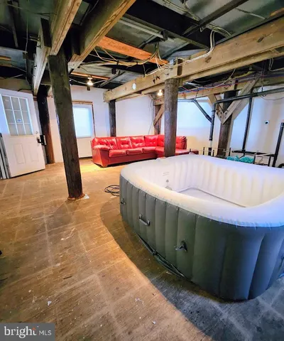 a view of a room with wooden walls