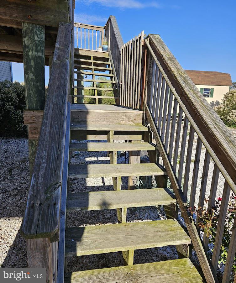 167 Cove Road Newport, NJ 08345 - Photo 10 of 37 a view of staircase with wooden floor and windows