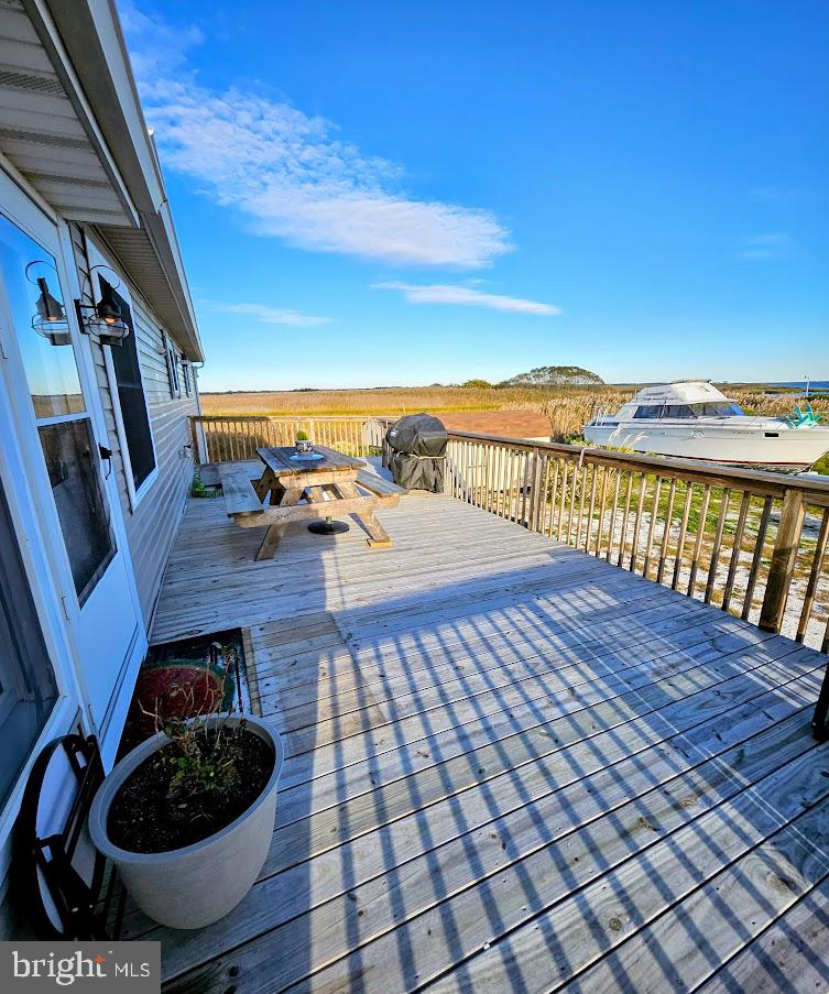 167 Cove Road Newport, NJ 08345 - Photo 10 of 38 a view of a balcony with chair and wooden floor