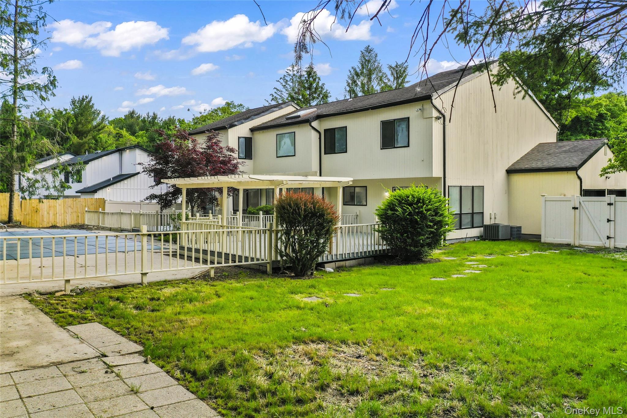 126 Bagatelle Road Melville, NY 11747 - Photo 40 of 50 a view of a house with a yard and plants