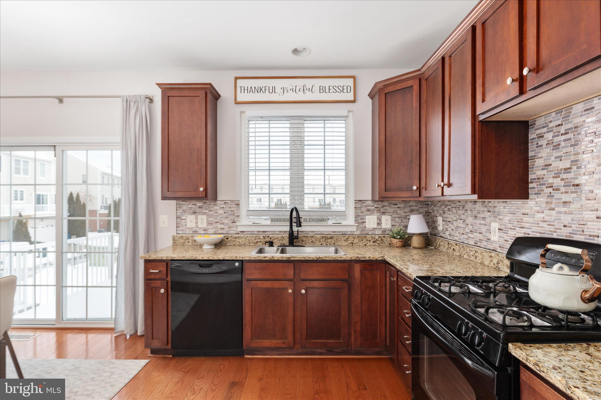 42824 Nations Street Chantilly, VA 20152 - Photo 11 of 26 a kitchen with granite countertop a stove sink and cabinets