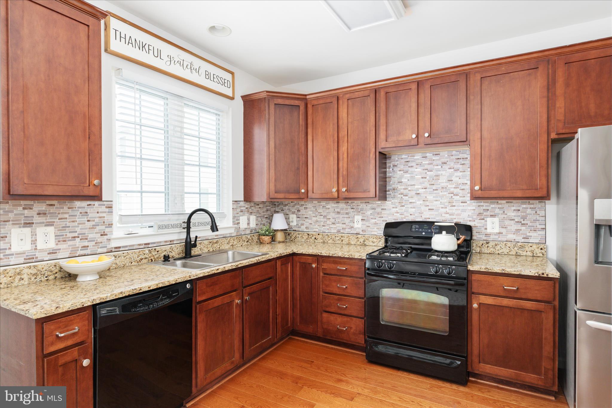42824 Nations Street Chantilly, VA 20152 - Photo 12 of 26 a kitchen with a sink stove top oven and cabinets