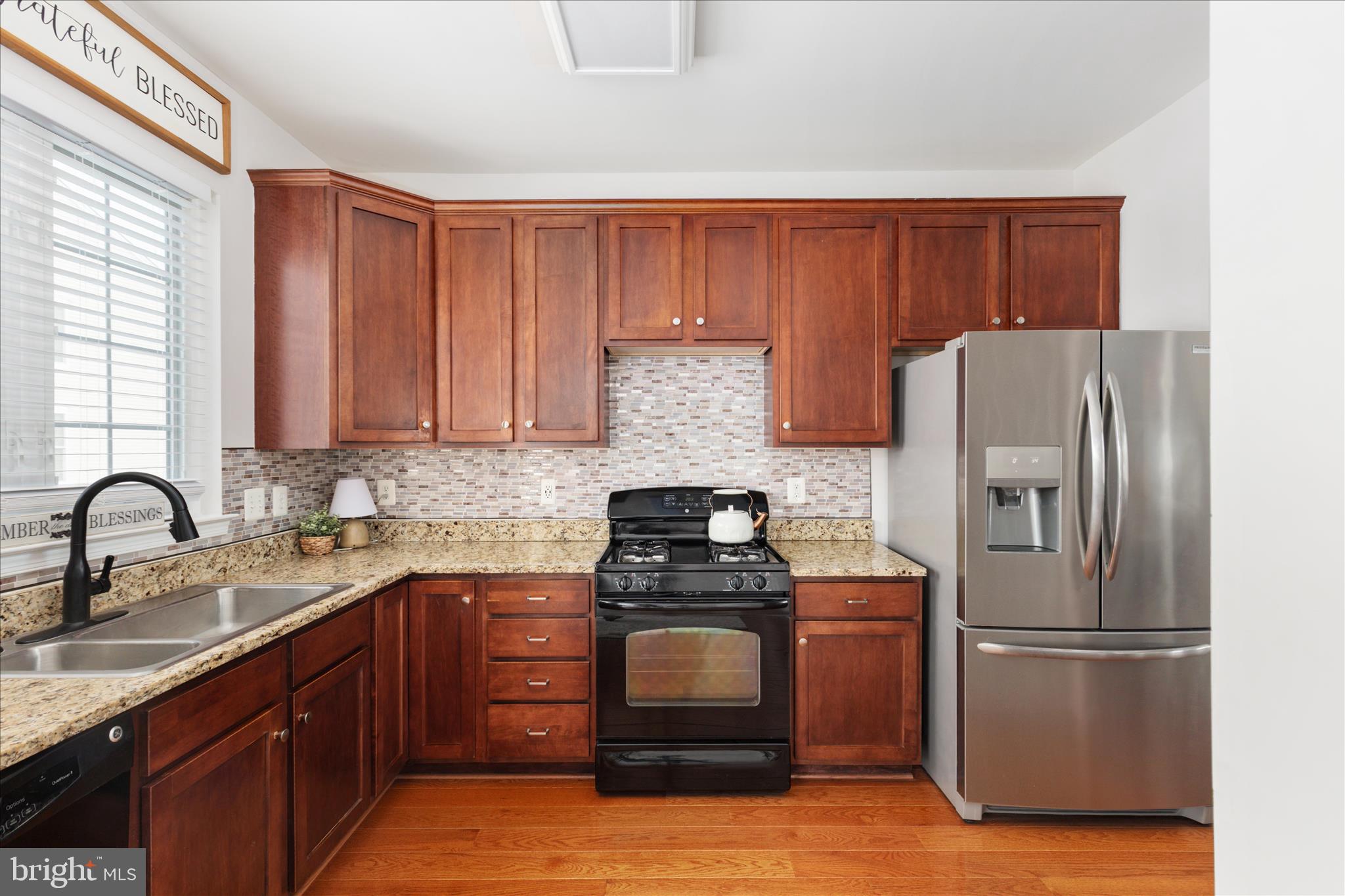 42824 Nations Street Chantilly, VA 20152 - Photo 13 of 26 a kitchen with a refrigerator sink and stove