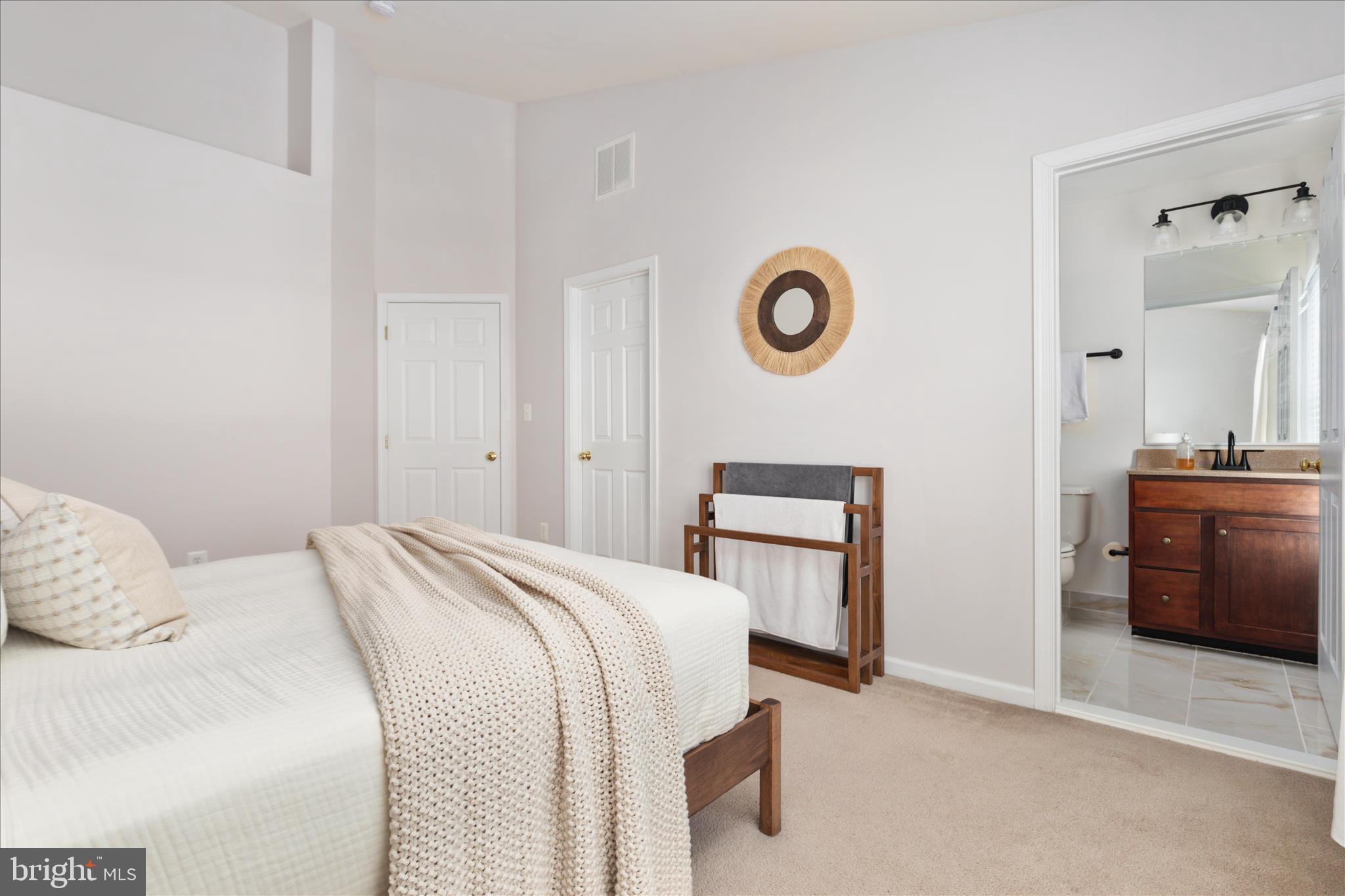 42824 Nations Street Chantilly, VA 20152 - Photo 21 of 26 a bedroom with a bed and a lamp