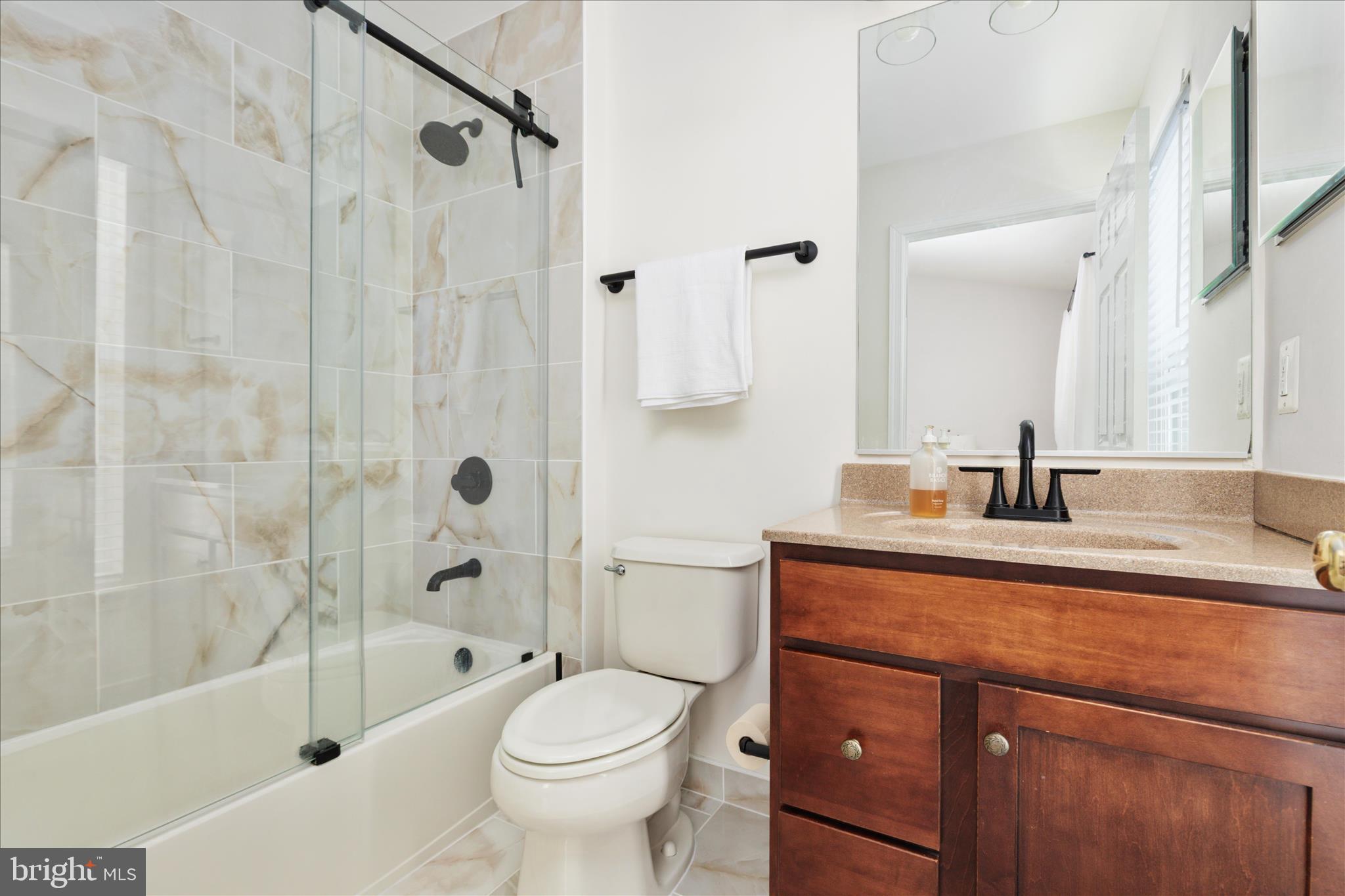 42824 Nations Street Chantilly, VA 20152 - Photo 22 of 26 a bathroom with a sink a toilet and shower