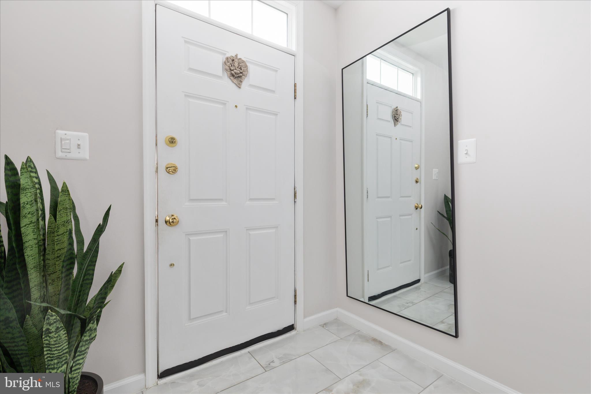 42824 Nations Street Chantilly, VA 20152 - Photo 3 of 26 a view of a elevator and mirror
