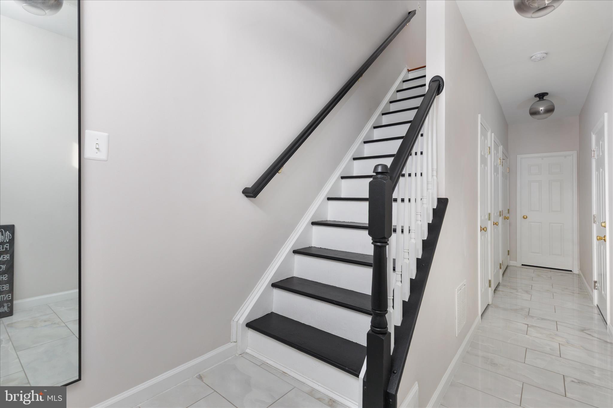 42824 Nations Street Chantilly, VA 20152 - Photo 4 of 26 a view of entryway and hall with wooden floor
