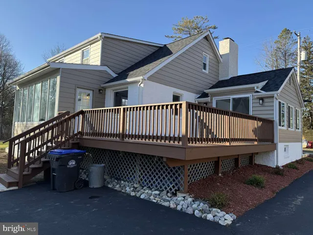 a view of a wooden deck with a chairs