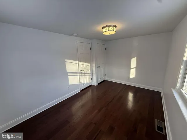 a view of gallery with wooden floor