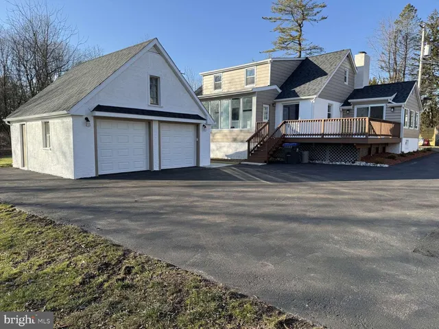 a view of a house with a wooden deck
