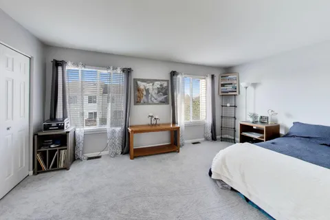 a bed room with furniture and a window