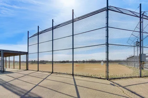 a view of a patio with wooden fence