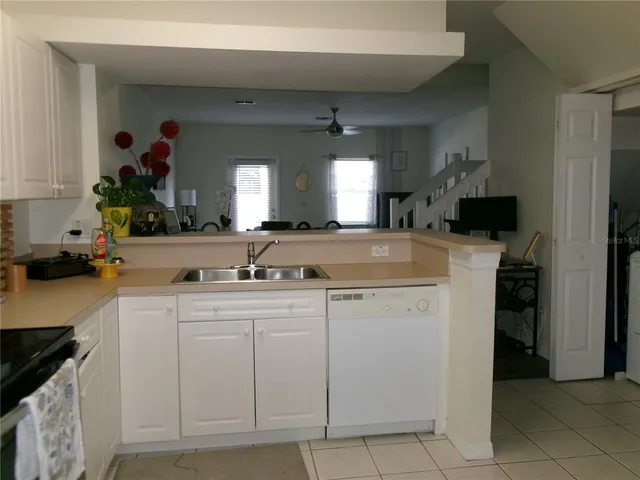a kitchen with a sink and cabinets