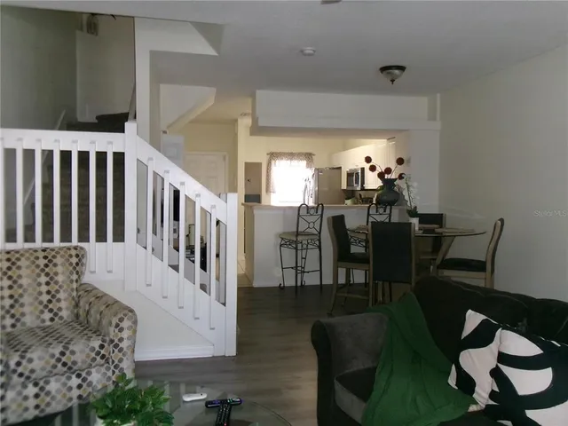 a bedroom with a bed and a mirror on dresser