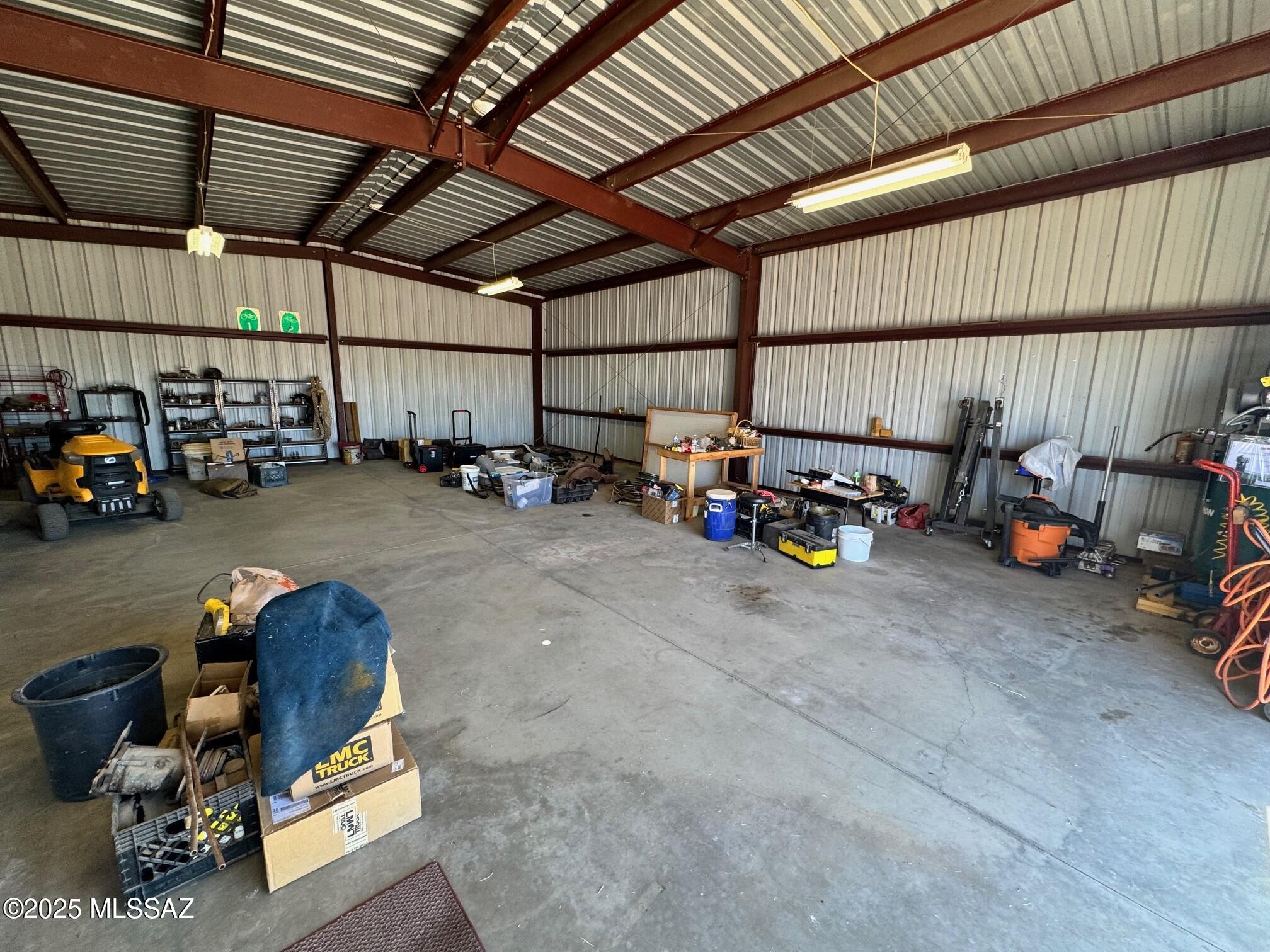 13384 South Cottonwood Road Pearce, AZ 85625 - Photo 32 of 46 a view of a garage with parked cars