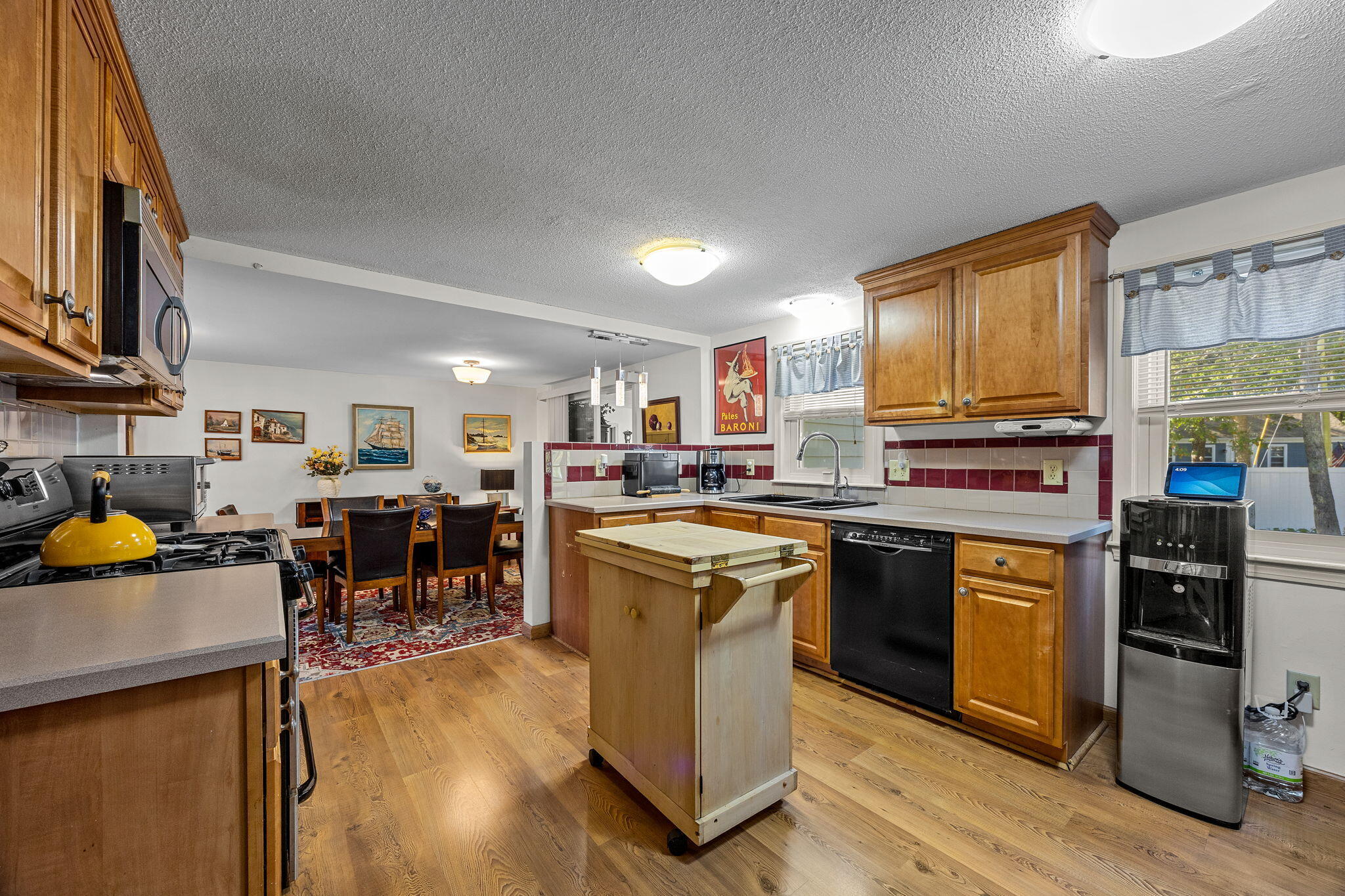 21 Brian Lane Hyannis, MA 02601 - Photo 14 of 38 a kitchen with lots of counter top space and stainless steel appliances