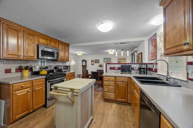 a bedroom with a large bed and furniture