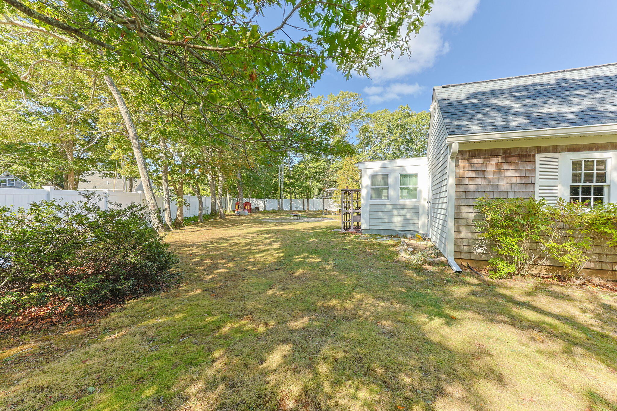 21 Brian Lane Hyannis, MA 02601 - Photo 4 of 38 a view of a house with a yard and plants