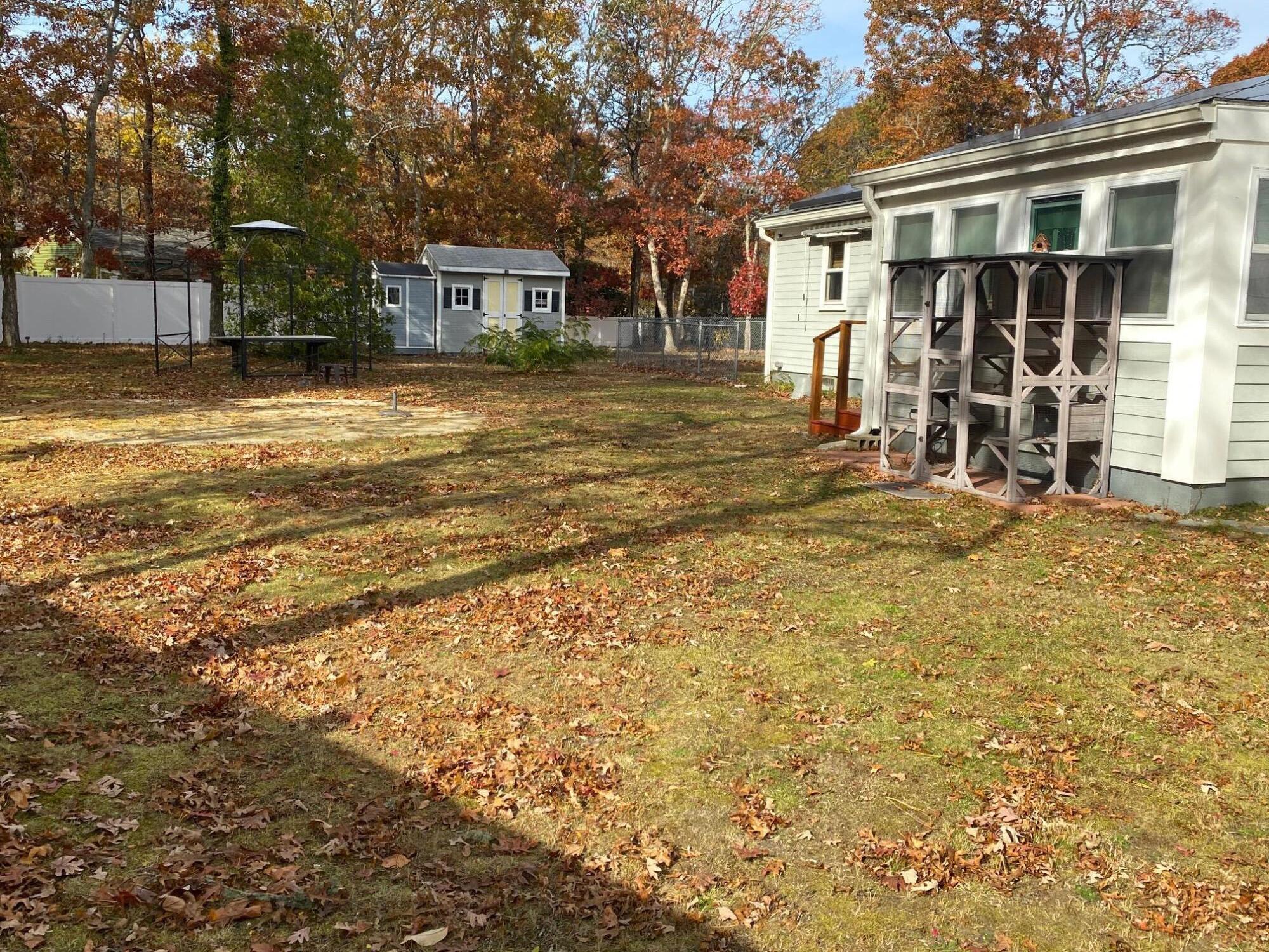 21 Brian Lane Hyannis, MA 02601 - Photo 5 of 38 a view of a house with a yard