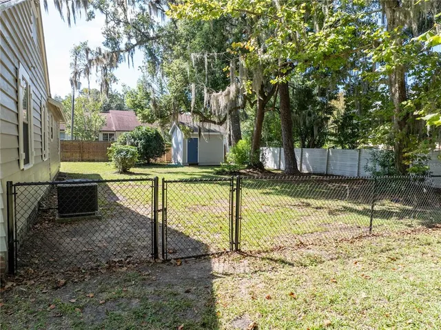 a view of swimming pool with a yard