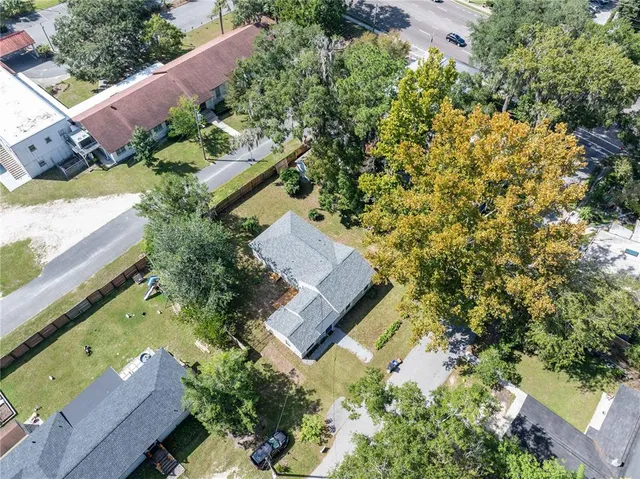 an aerial view of house with yard