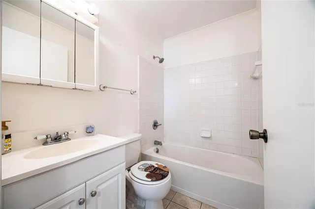 a bathroom with a sink a toilet and a bathtub
