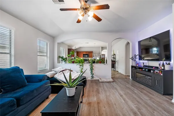 a living room with furniture and a flat screen tv