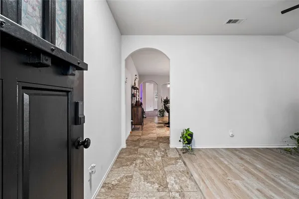 a view of a hallway view with staircase