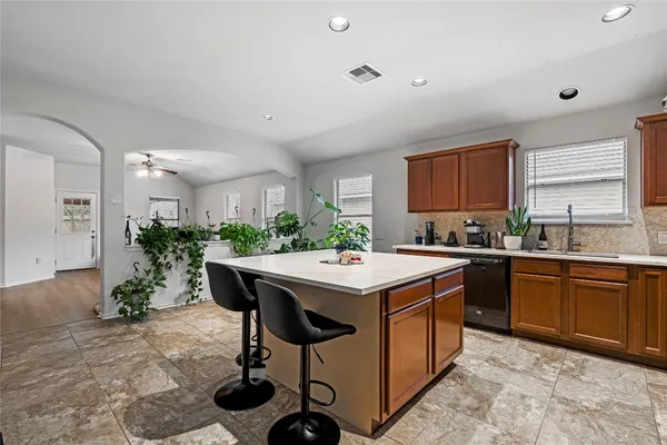 a kitchen with a table and chairs in it