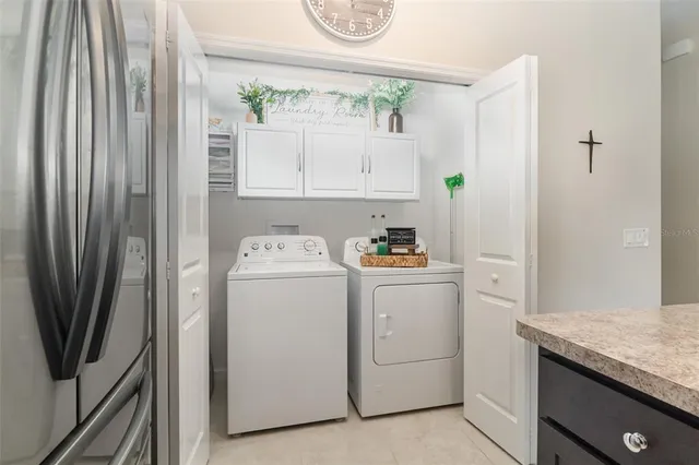 a utility room with dryer and washer