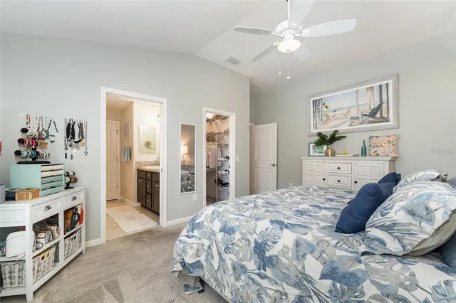 a bedroom with a bed and a cabinets