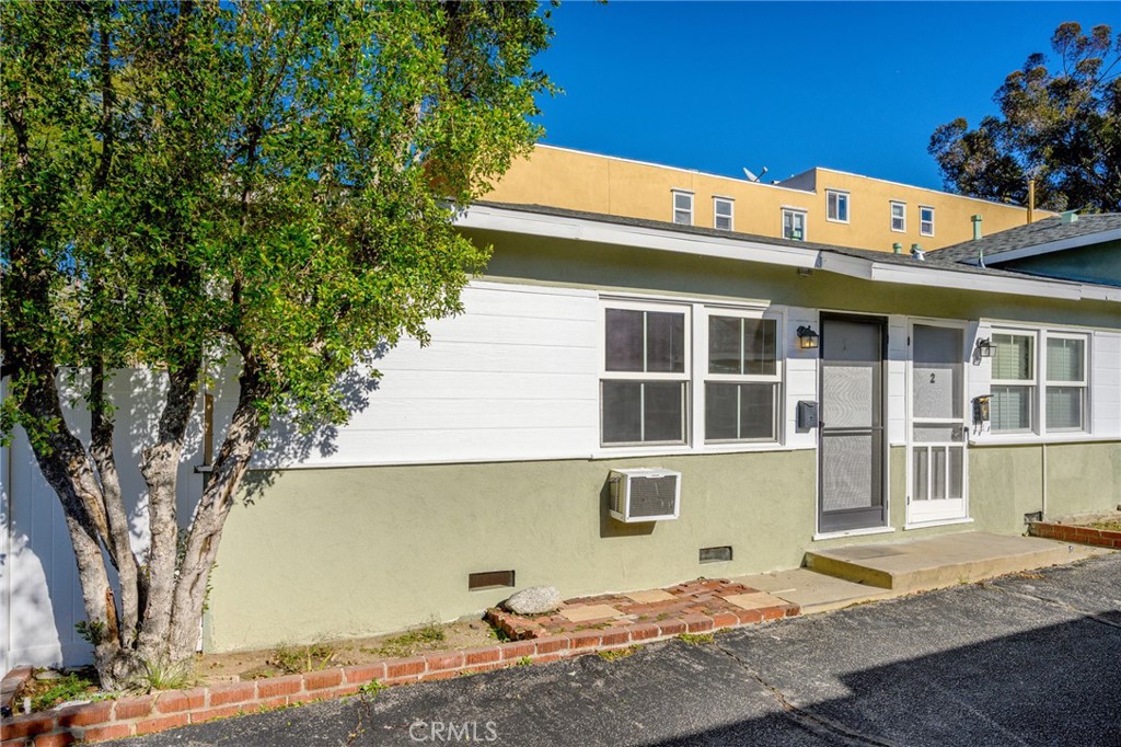 10230 Silverton Avenue, Unit 1 Tujunga, CA 91042 - Photo 17 of 26 a front view of a house with a yard