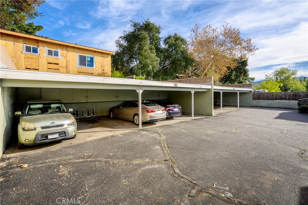 10230 Silverton Avenue, Unit 1 Tujunga, CA 91042 - Photo 22 of 26 a front view of a house with parking area