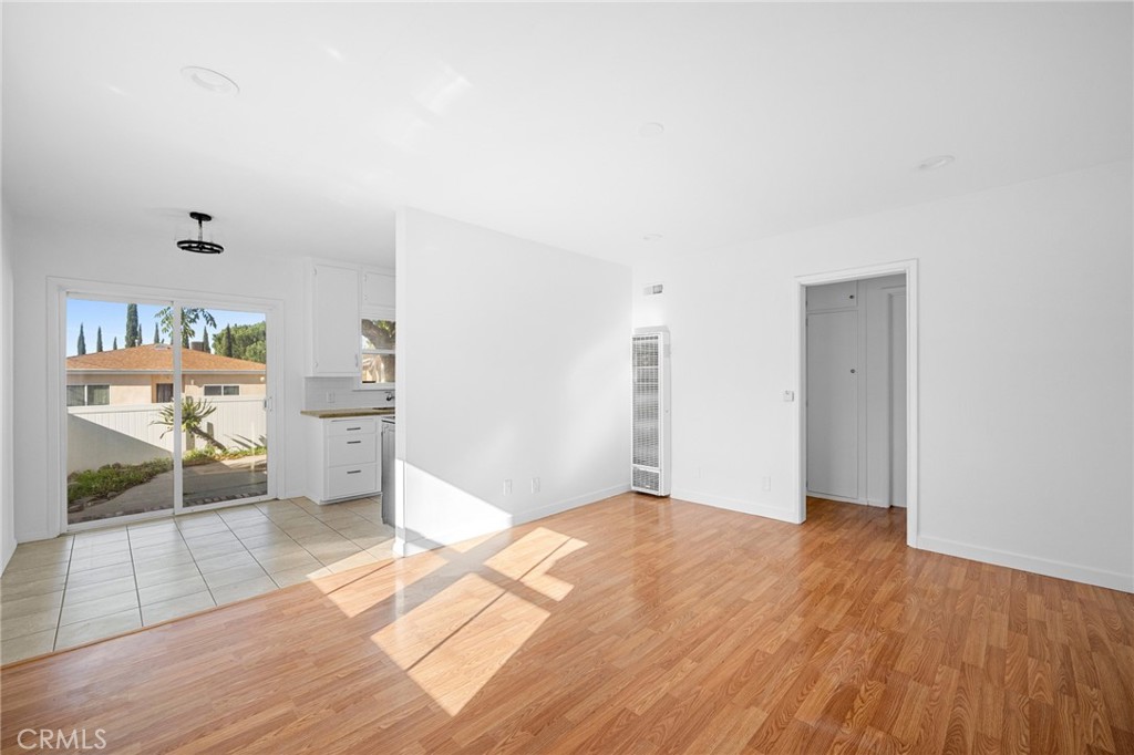 10230 Silverton Avenue, Unit 1 Tujunga, CA 91042 - Photo 3 of 26 a view of livingroom with furniture and wooden floor