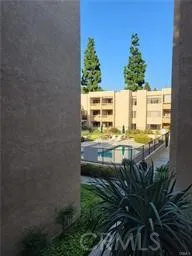 a view of building with outdoor space and seating