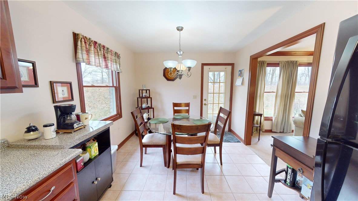 167 Mathews Road, Unit B Youngstown, OH 44512 - Photo 14 of 34 Tiled dining space with a notable chandelier